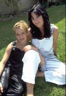 Aaron shirtless with his mom, Jane